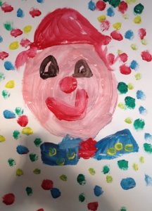 Kleurige clown met vrolijke stippen